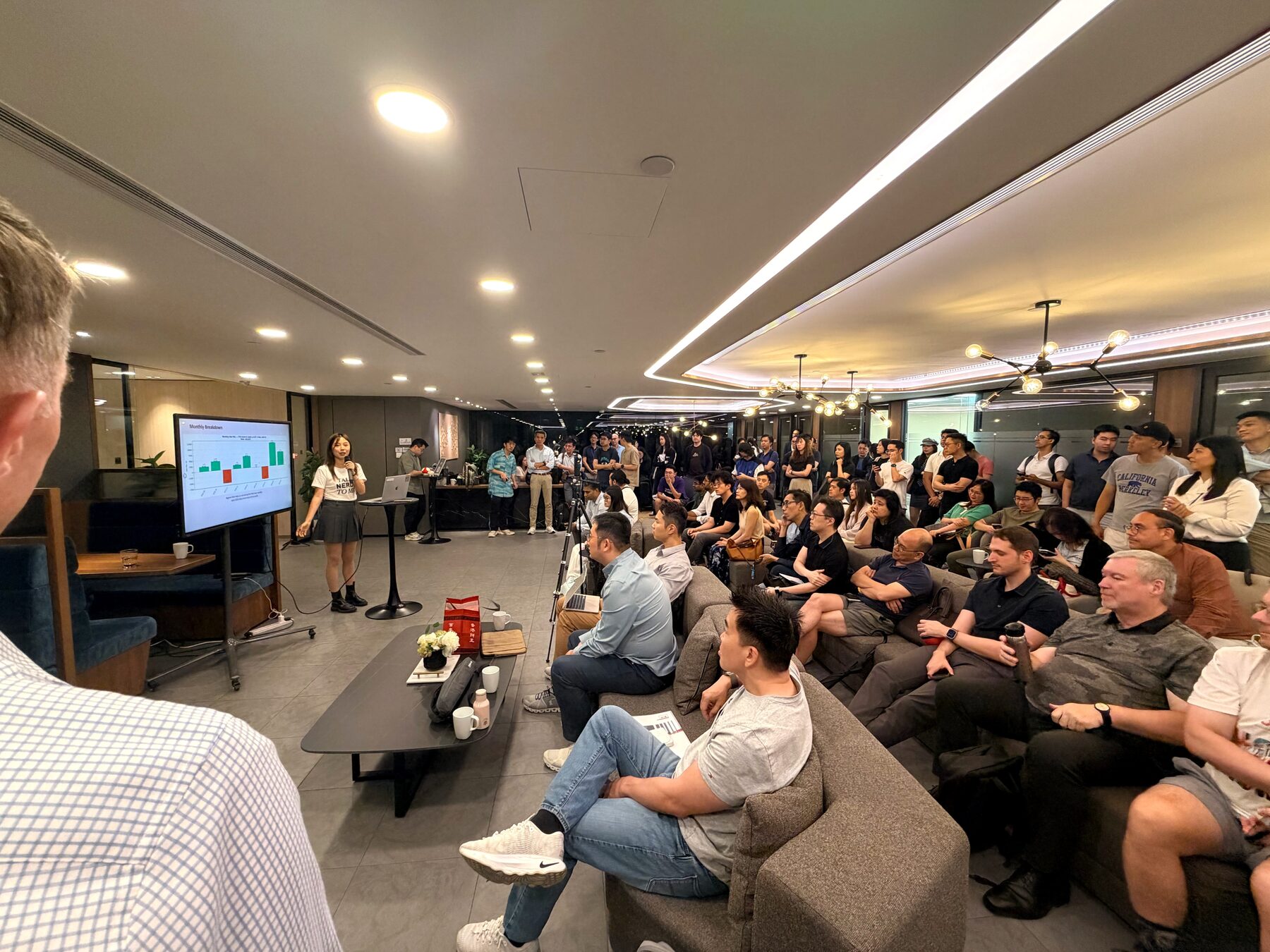 Speaker presenting to the packed AI Trading workshop audience